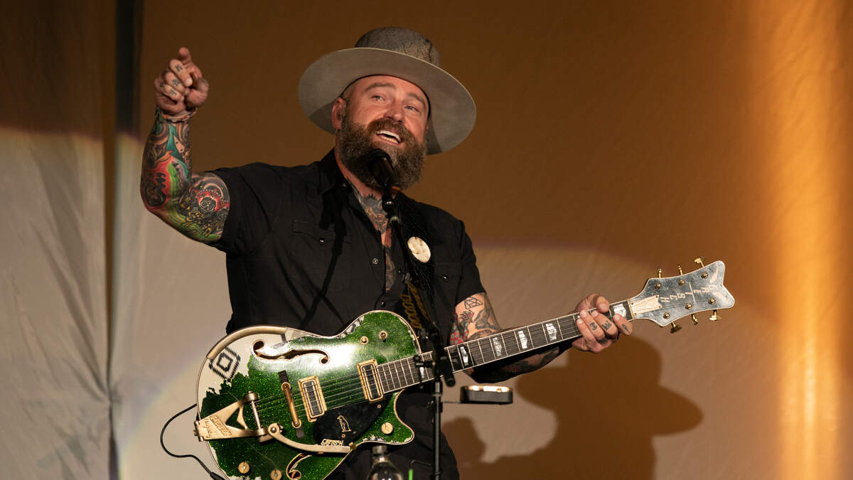 Zac Brown encourages the crowd to sing along with him in concert, Thursday night, October. 5, 2023 at Raleigh, N.C.’s Coastal Credit Union Music Park at Walnut Creek.