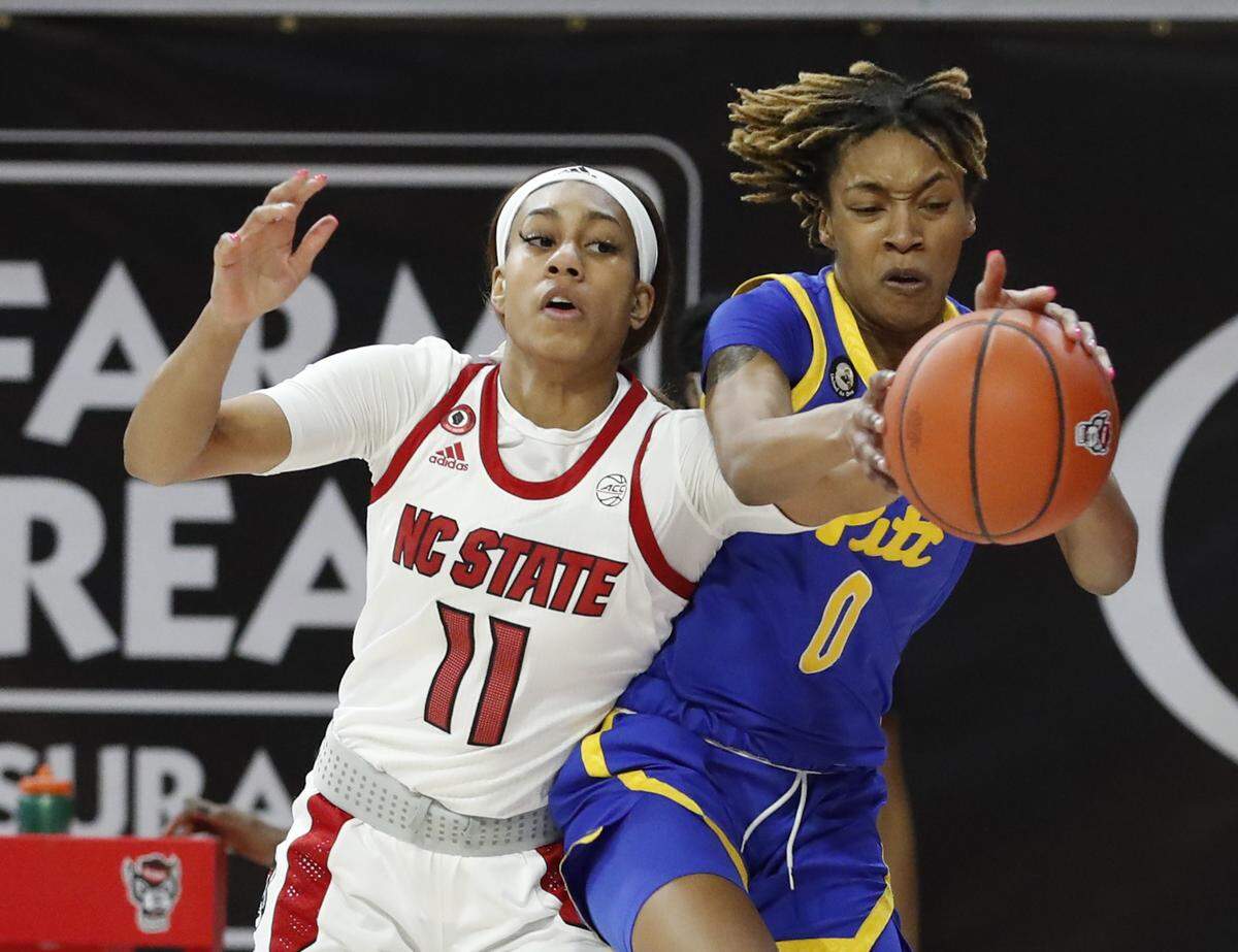 Pittsburgh’s Sandrine Clesca (0) pulls the rebound from N.C. State’s Jakia Brown-Turner (11) during the first half of N.C. State’s game against Pittsburgh at Reynolds Coliseum in Raleigh, N.C., Thursday, February 25, 2021.