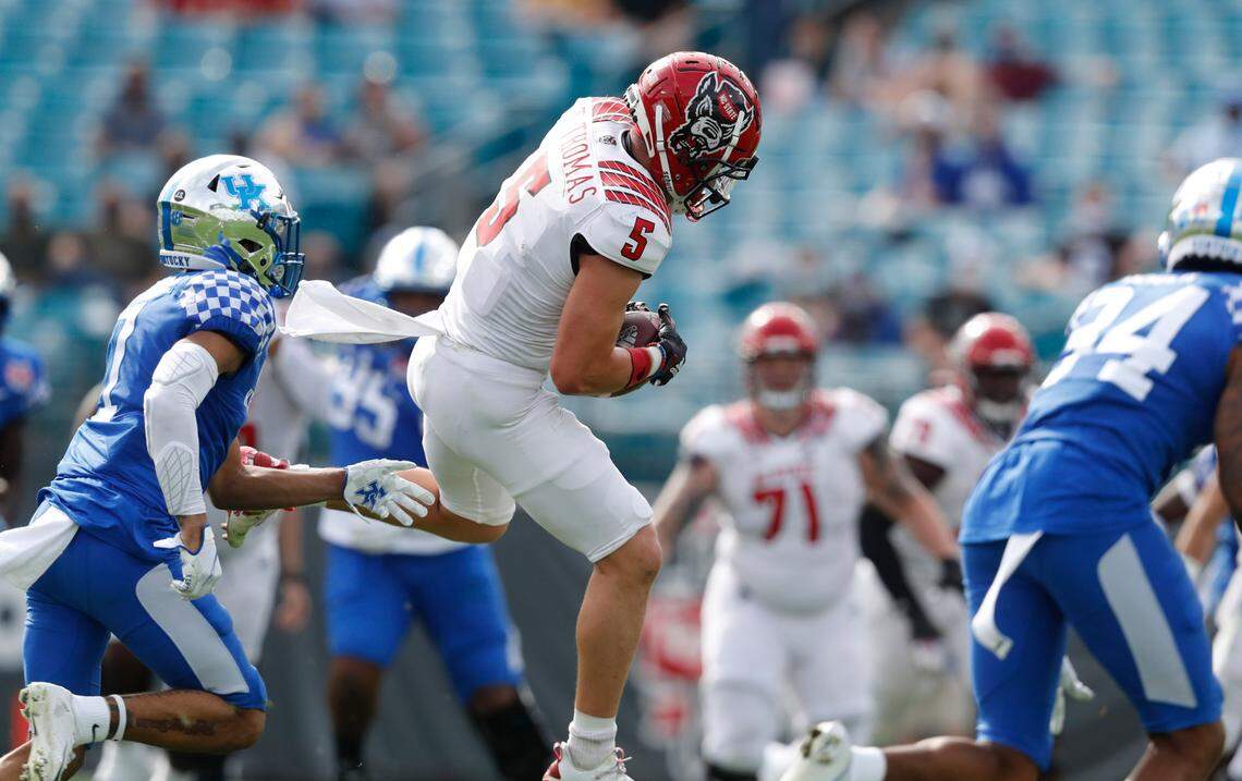 N.C. State wide receiver Thayer Thomas (5) makes the reception during the first half of N.C. State’s game against Kentucky in the Gator Bowl at TIAA Bank Field in Jacksonville, Fla., Saturday, January 2, 2021.