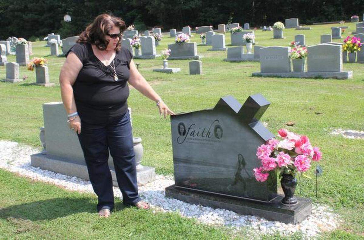 Connie Hedgepeth pauses at the grave of her daughter Faith Hedgepeth.