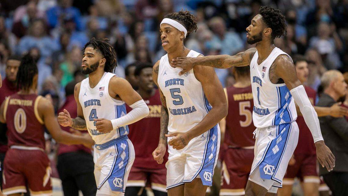 North Carolina’s Leaky Black (1) gives teammate Armando Bacot (5) a pat on the chest as Elon calls a time-out following a Bacot basket in the second half on Saturday, December 11, 2021 at the Smith Center in Chapel Hill, N.C.