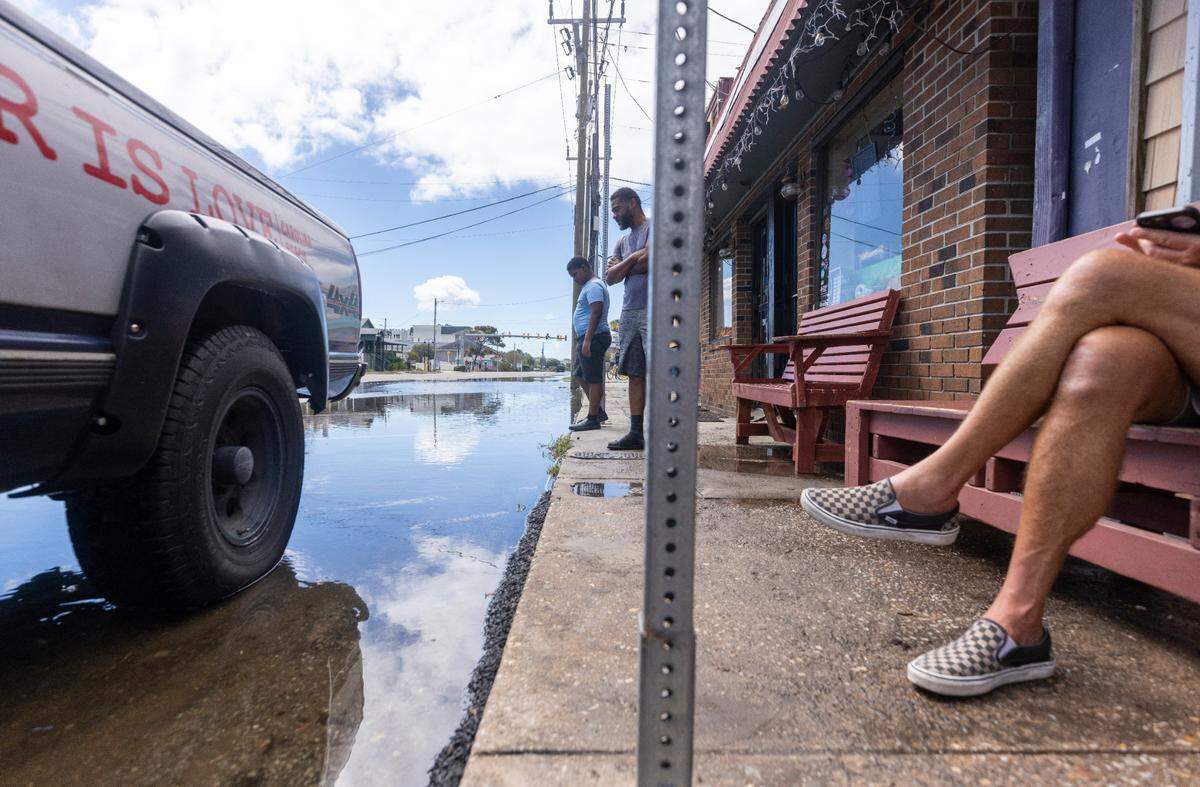 Floodwaters recede outside Fat Pelican bar in Carolina Beach on Tuesday, Sept. 17, 2024 after an unnamed storm dropped as much as 18 inches of rain in southeastern North Carolina over a 72-hour period. Flood Levels in Carolina Beach rivaled that of Hurricane Floyd in 1999.