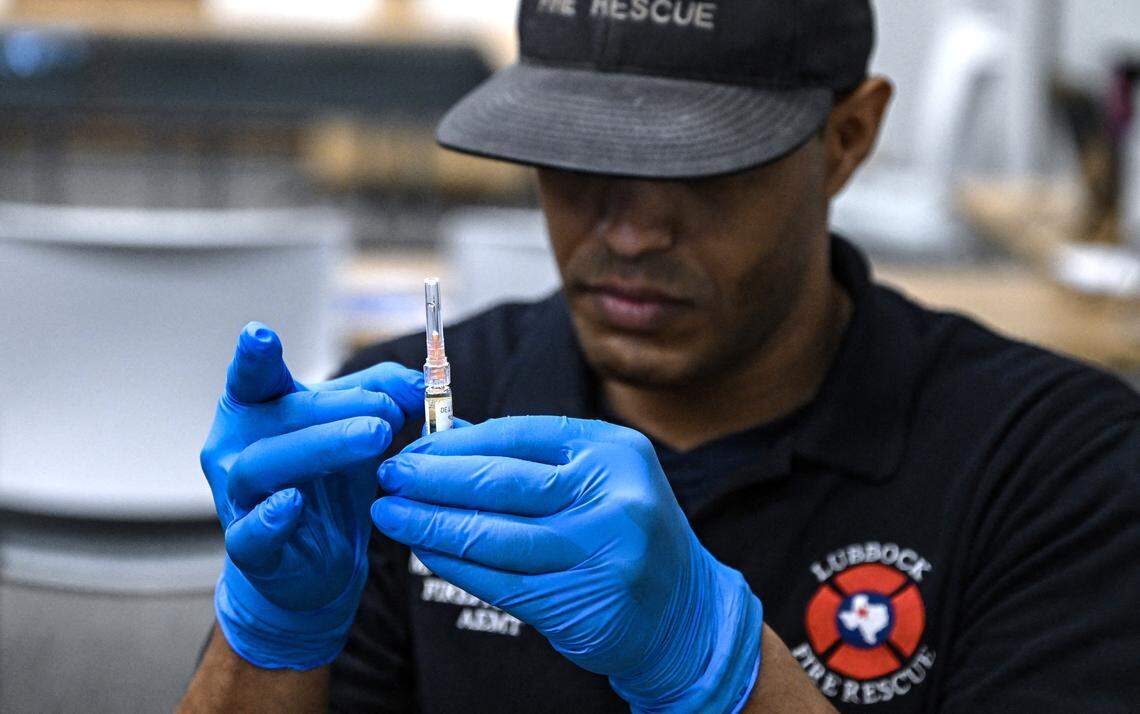 A paramedic gets ready to administer a dose of the measles vaccine at a health center in Lubbock, Texas, on February 27, 2025.