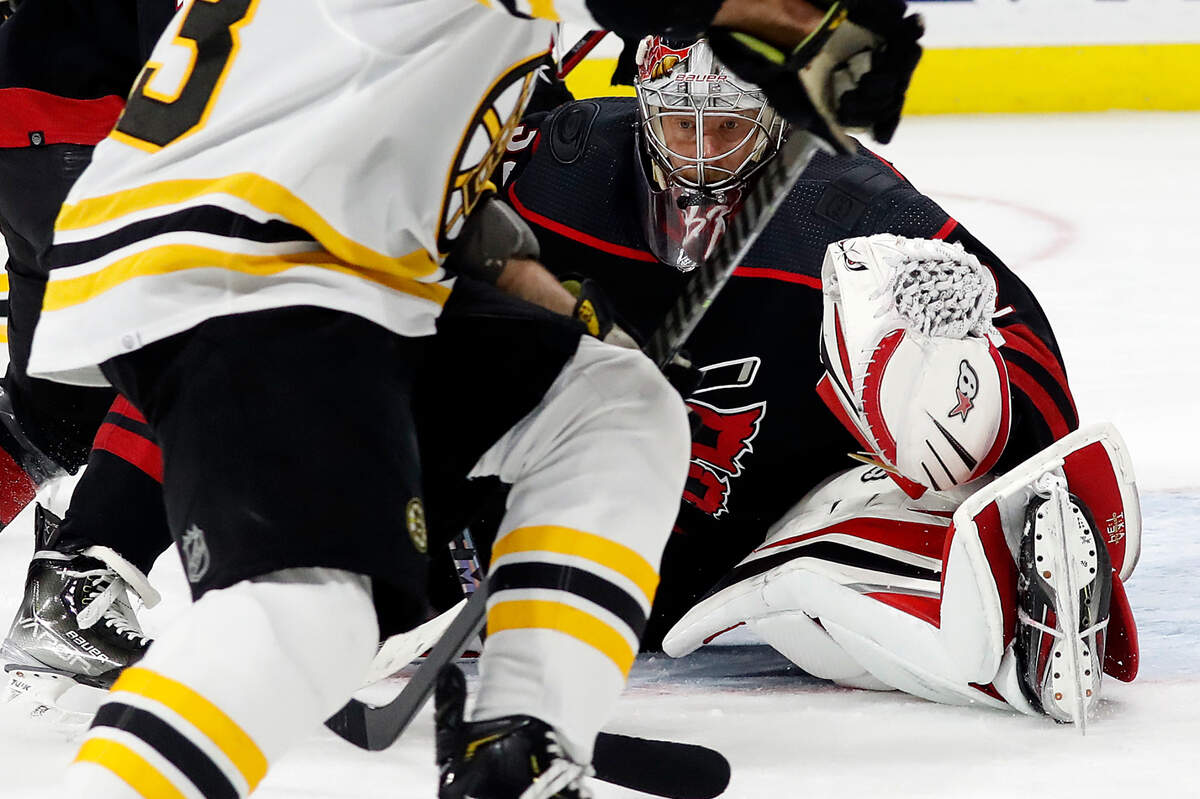 Carolina Hurricanes goaltender Antti Raanta (32) watches the puck against the Boston Bruins during the first period of Game 5 of an NHL hockey Stanley Cup first-round playoff series in Raleigh, N.C., Tuesday, May 10, 2022. (AP Photo/Karl B DeBlaker)