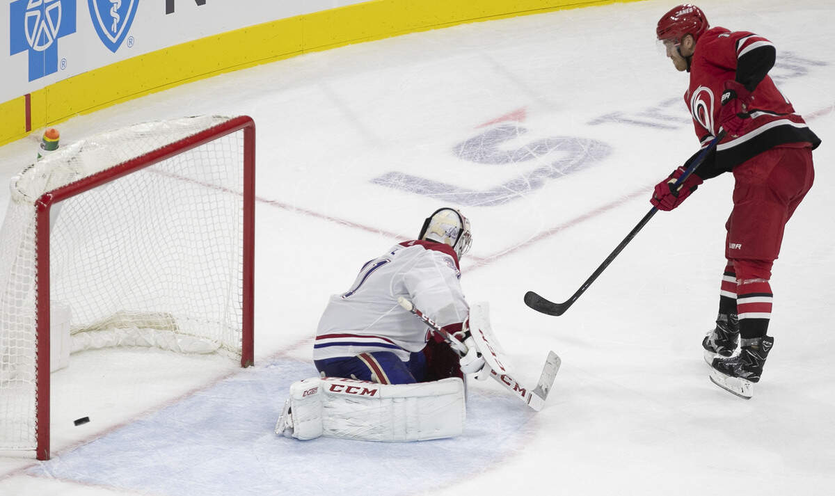 Carolina Hurricanes’ Dougie Hamilton (19) scores on Montreal goalie Carey Prince (31) during the shootout to give the Hurricanes’ a 4-3 victory on Thursday, October 3, 2019 at the PNC Arena in Raleigh, N.C.