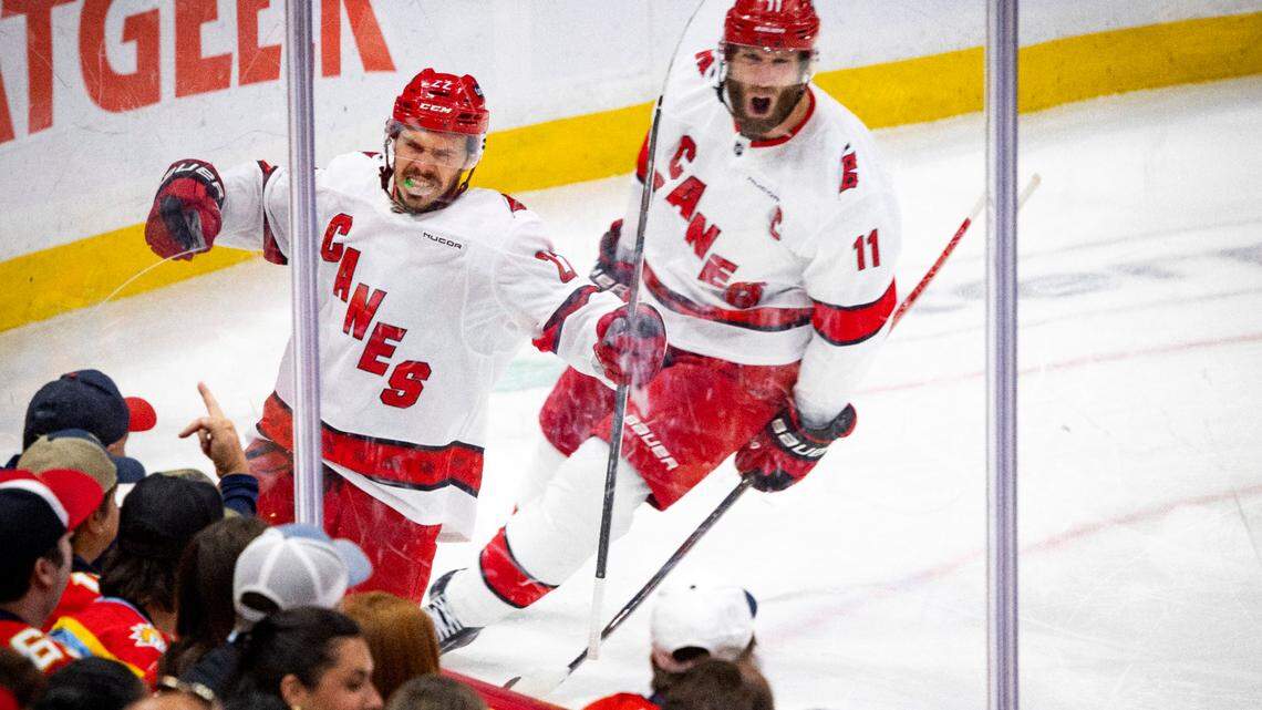 Carolina Hurricanes center Logan Stankoven (22) celebrates his goal and center Jordan Staal (11) cheers in the second period of Game 4 during the Eastern Conference final of the NHL Stanley Cup playoffs against the Florida Panthers at the Amerant Bank Arena on Monday, May 26, 2025 in Sunrise, Fla.