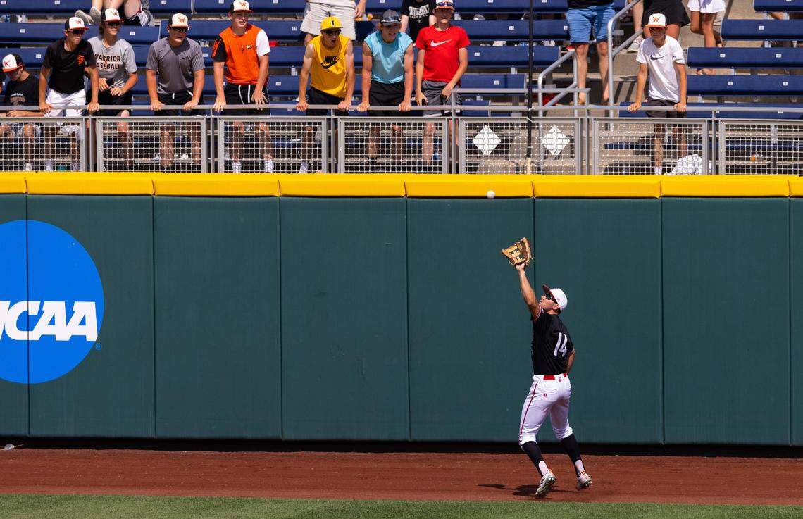 North Carolina State’s Jonny Butler (14) catches a fly ball to center field hit by Vanderbilt’s Parker Noland in the seventh inning during a baseball game in the College World Series, Friday, June 25, 2021, at TD Ameritrade Park in Omaha.