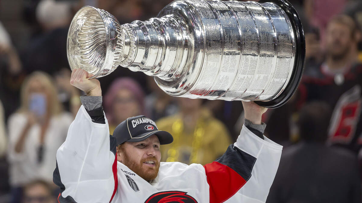 Carolina Hurricanes captain Jordan Staal (11) handed the Stanley Cup to goalie Frederik Andersen (31), after defeating the Vegas Golden Knights 3-0 in Game 6 on Sunday, June 14, 2026 at T-Mobile Arena in Las Vegas, NV. Andersen lead the Hurricanes through the playoffs until he was pulled in Game 3 of the Stanley Cup Final.