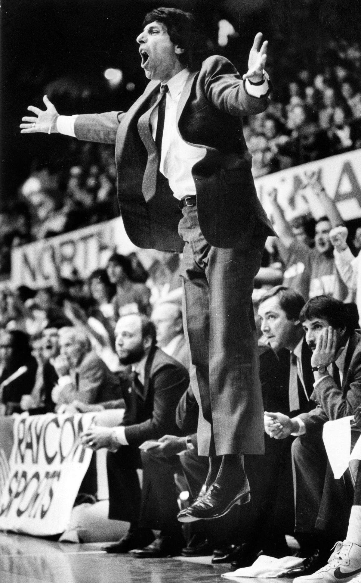 NC State coach Jim Valvano jumps off the floor as he reacts to an official’s call in action against UNC in March 1987.