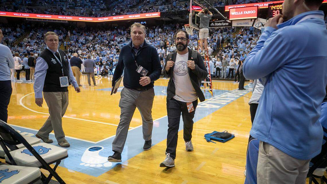 The News & Observer’s Luke DeCock and Joe Ovies of 99.9 The Fan, leave the Dean E. Smith Center at halftime of the North Carolina vs. Virginia game on Saturday, February 25, 2023 at the Smith Center in Chapel Hill, N.C.