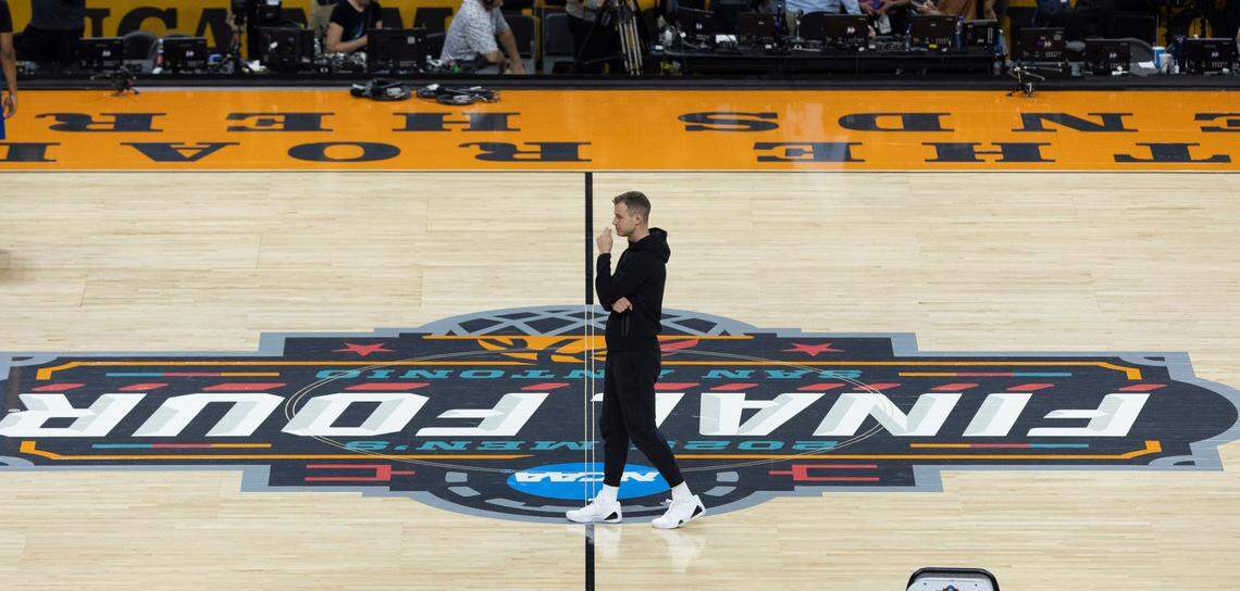 Duke coach Jon Scheyer walks across the NCAA Final Four logo as he watches his team practice on Friday, April 4, 2025 at the Alamodome in San Antonio, TX.