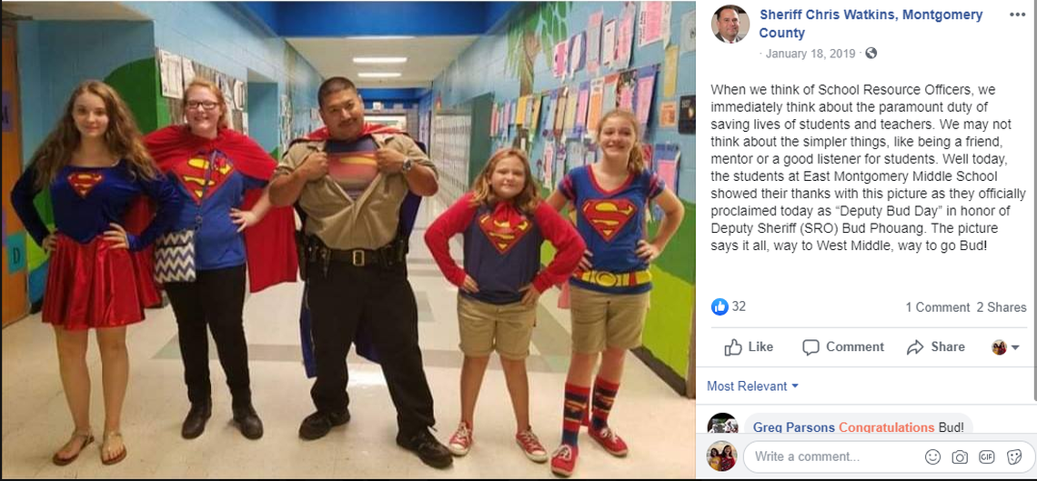A 2019 screen shot from Facebook shows school resource officer Bud Phouang posing with students for “Deputy Bud Day.”