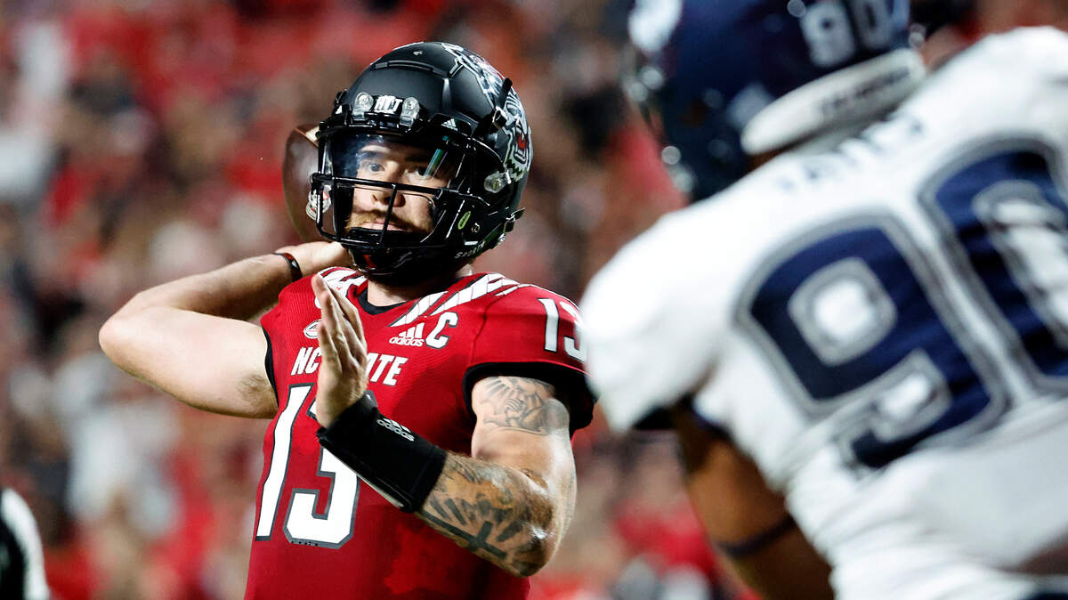 North Carolina State’s Devin Leary (13) prepares to pass the ball during the first half of an NCAA college football game against Connecticut in Raleigh, N.C., Saturday, Sept. 24, 2022.