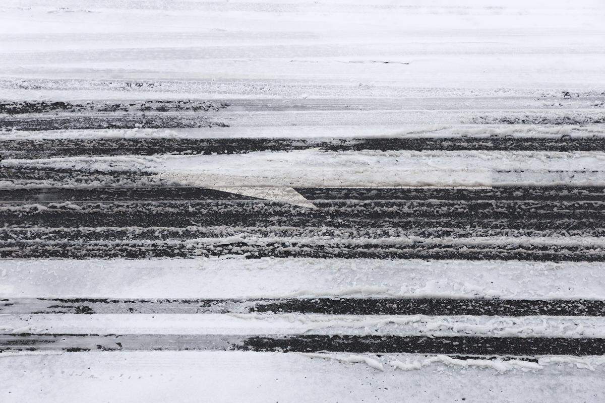 Ice partially covers a roadway in downtown Durham on Sunday, January 25, 2026.