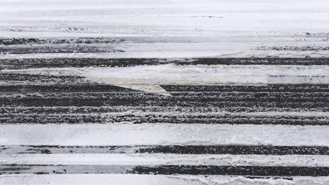 Ice partially covers a roadway in downtown Durham on Sunday, January 25, 2026.