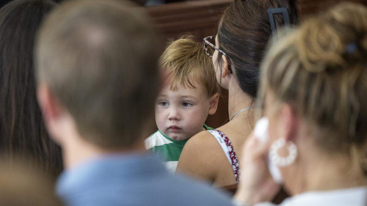 Jessica Oriente holds her and David Millette Jr.’s son Sunny David Millette during a sentencing hearing for Tyrell Moore on Monday, June 1, 2026, at the Wake County Justice Center in Raleigh. Moore pleaded guilty earlier this year to voluntary manslaughter in the death of David Millette Jr., who died after Moore struck him during a confrontation in Raleigh's Glenwood South district in August 2023.