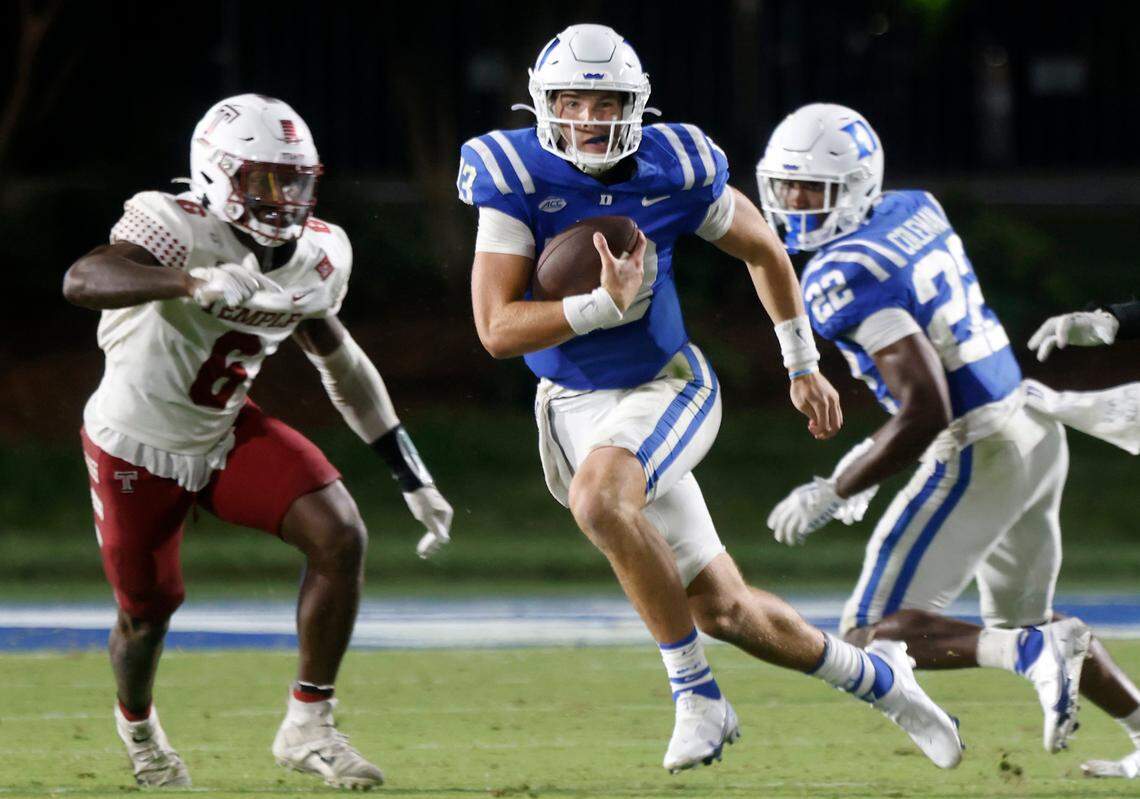 Duke quarterback Riley Leonard (13) runs the ball past Temple linebacker Jordan Magee (6) during the second half of the Blue Devilsí season opener at Wallace Wade Stadium on Friday, Sept. 2, 2022, in Durham, N.C.