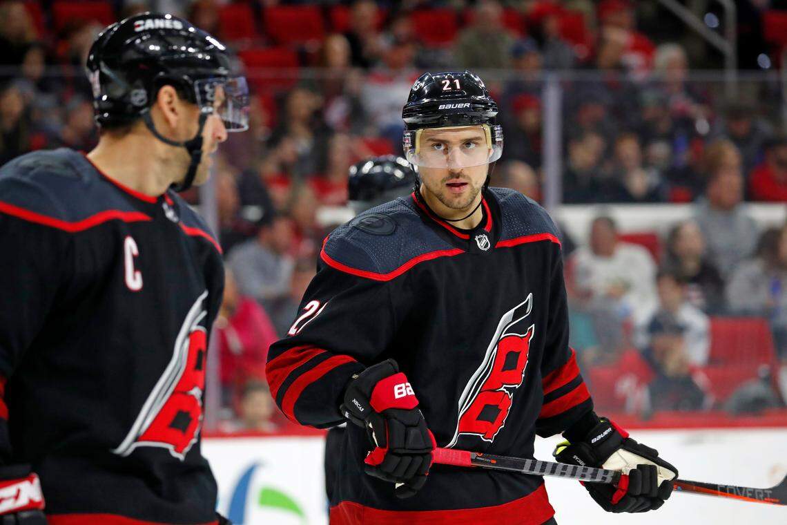 Carolina Hurricanes’ Nino Niederreiter (21) talks with Justin Williams (14) prior to a face-off against the Ottawa Senators during the second period of an NHL hockey game, Friday, Jan. 18, 2019, in Raleigh, N.C. (AP Photo/Karl B DeBlaker)