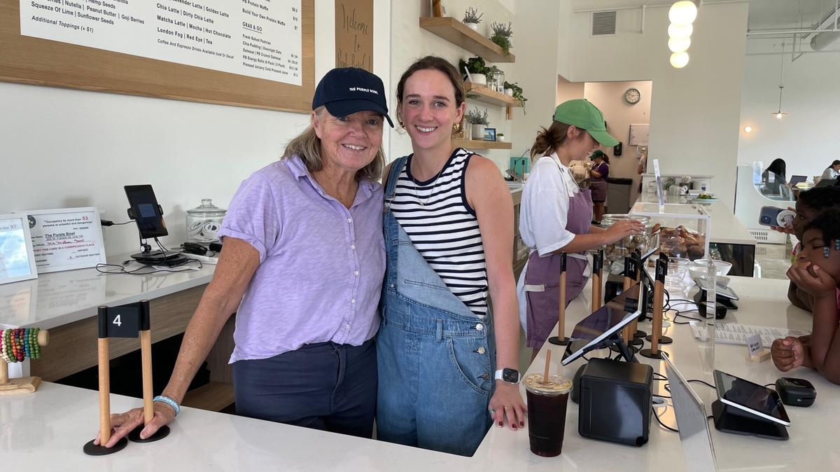Purple Bowl co-owner Paula Gilland, at left, and General Manager McClaren Hopper pose for a photo at the restaurant’s front counter on Wednesday, Oct. 2, 2024. The newly renovated space features a separate coffee bar and a 2,000-square-foot patio.