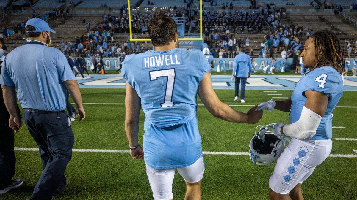 North Carolina defensive back Trey Morrison (4) consoles quarterback Sam Howell (7) following the Tar Heels’ 35-25 loss to Florida State on Saturday in Chapel Hill. UNC is 3-3 this season.