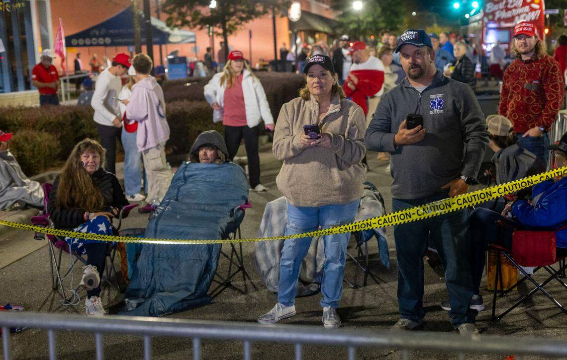 Dorothea Ohlandt of Franklinton, left, Karen Little, center, of Rocky Mount, and Donald Duke, right of Henderson were among the first in line to enter a rally for Republican presidential nominee former President Donald Trump on Wednesday, October 30, 2024 at the Rocky Mount Event Center in Rocky Mount, N.C. This group all arrived well before midnight Tuesday to stake out their spots in line.
