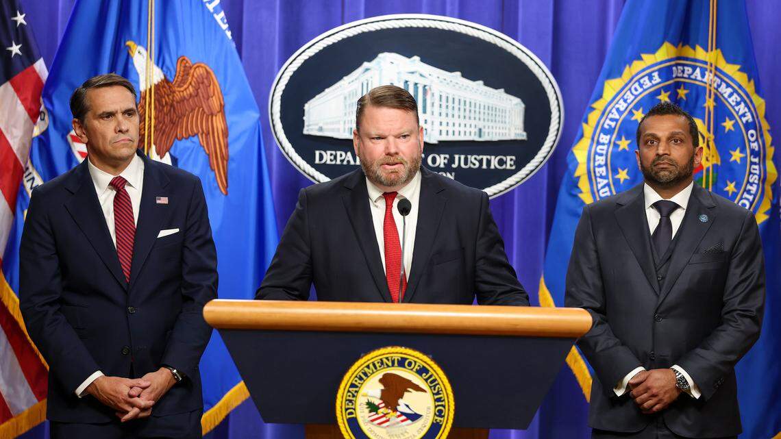 Ellis Boyle, United States Attorney&nbsp;for the Eastern District of North Carolina speaks as Acting Attorney General Todd Blanche (left) and FBI Director Kash Patel listen at a press conference on April 28, 2026 at the Department of Justice in Washington, DC. Charges were brought against former FBI Director James Comey on Tuesday in an investigation over a photo of seashells arranged on a beach posted to social media, that officials said constituted a threat against President Donald Trump. 