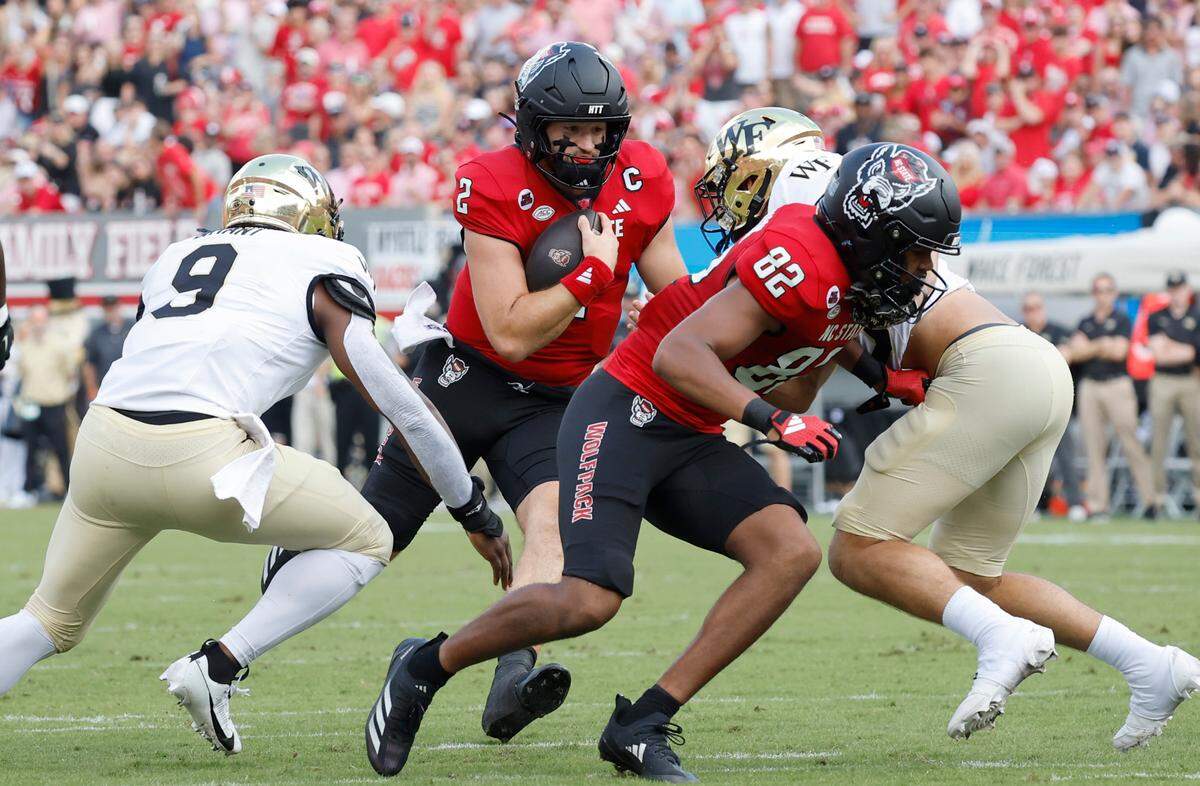 N.C. State quarterback Grayson McCall (2) scrambles for yards before he was hit and injured during the first half of N.C. State’s game against Wake Forest at Carter-Finley Stadium in Raleigh, N.C., Saturday, Oct. 5, 2024.