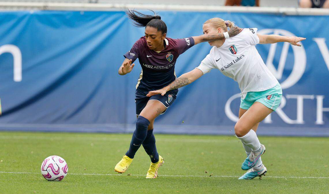 North Carolina forward Kerolin (9) gets by Kansas City defender Hailie Mace (4) during the first half of the Courage’s game against the Current at WakeMed Soccer Park in Cary, N.C., Saturday, March 25, 2023.