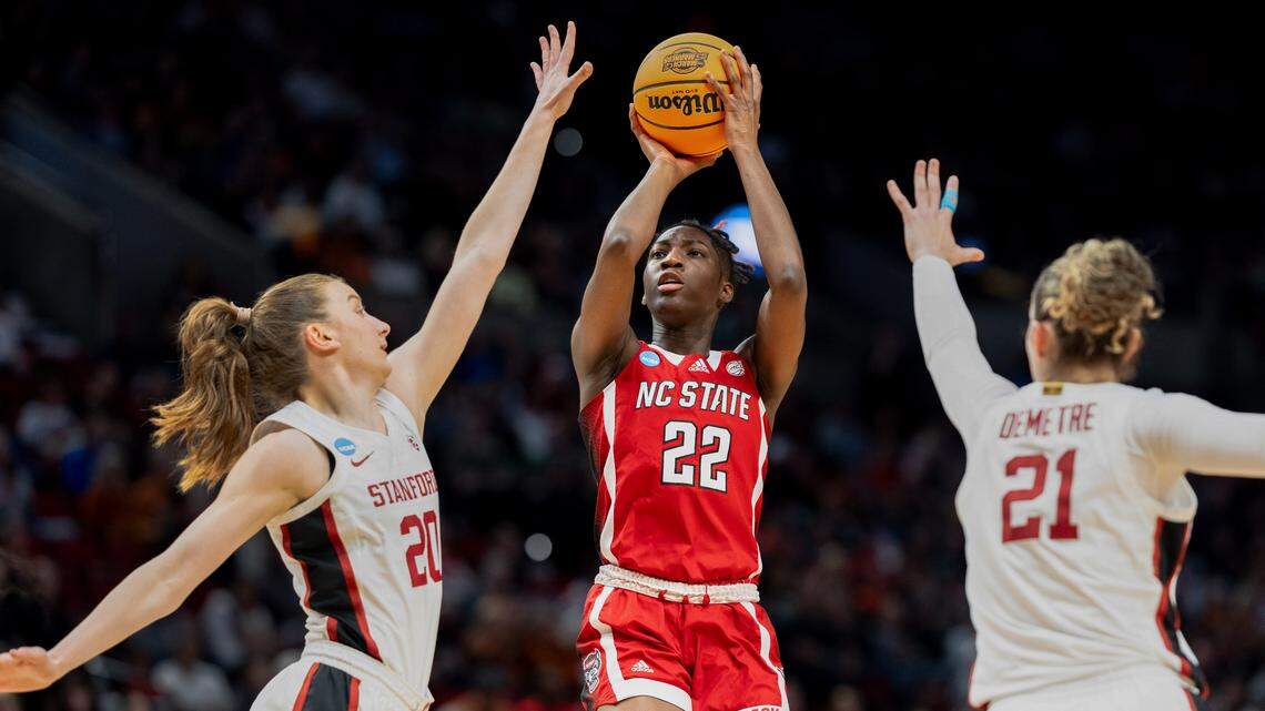 NC State’s Saniya Rivers shoots over Stanford defenders in the first half in NCAA Sweet !6 action in Portland.