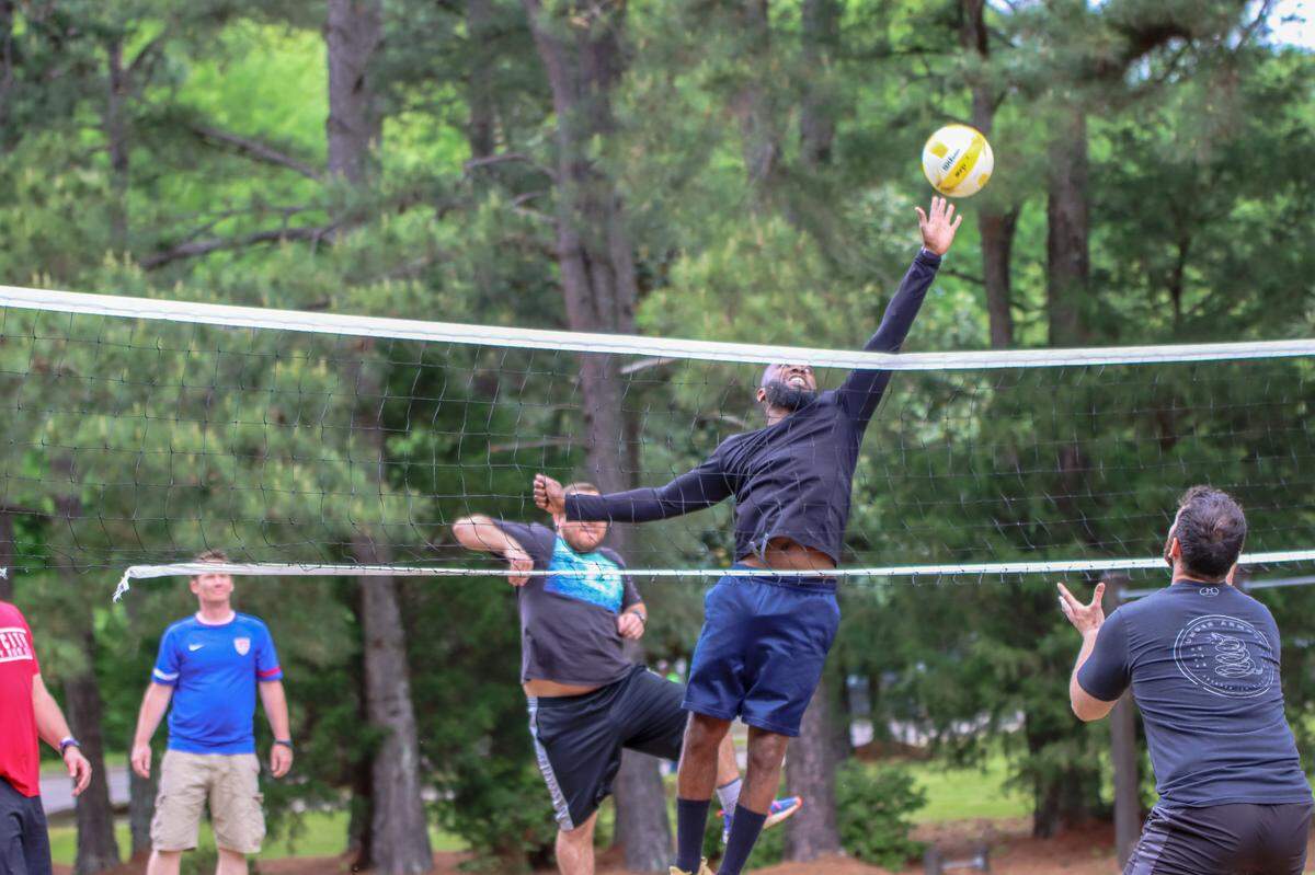 Landy Tyler jumps during a volleyball match at the Healing Transitions’ men’s campus.