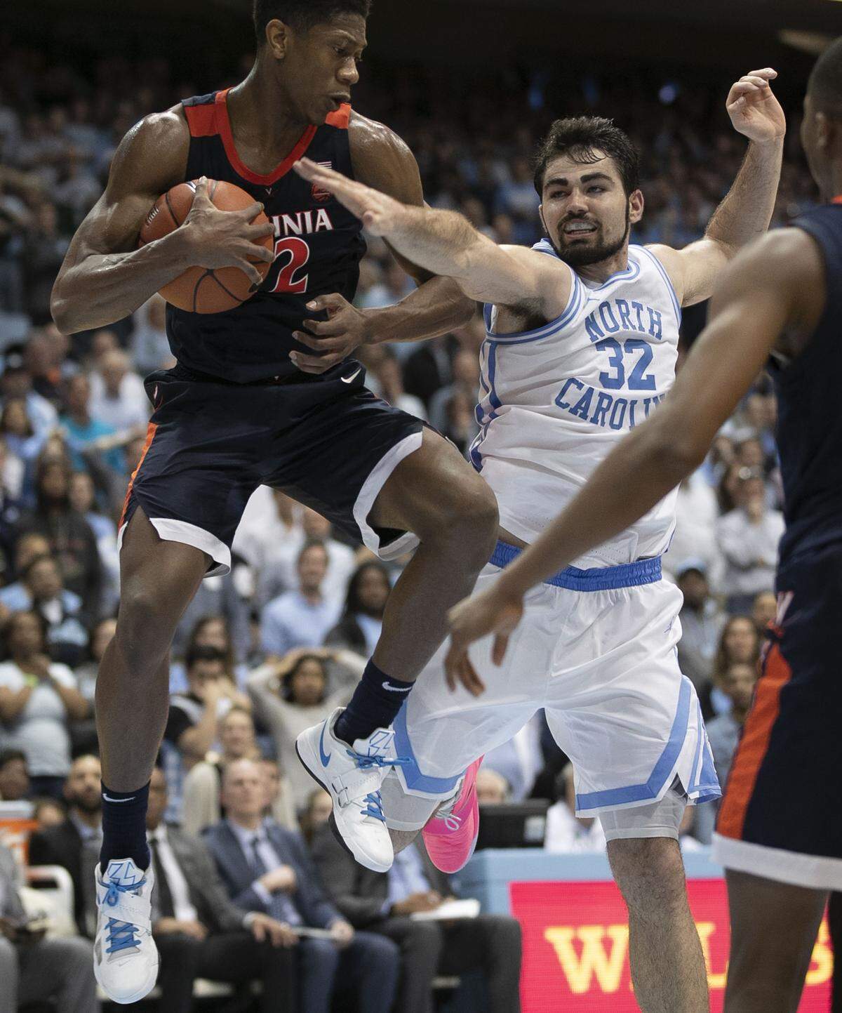 Virginia’s De’Andre Hunter (12) secures a rebound from North Carolina’s Luke Maye (32) in the second half on Monday, February 11, 2019 at the Smith Center in Chapel Hill, N.C.