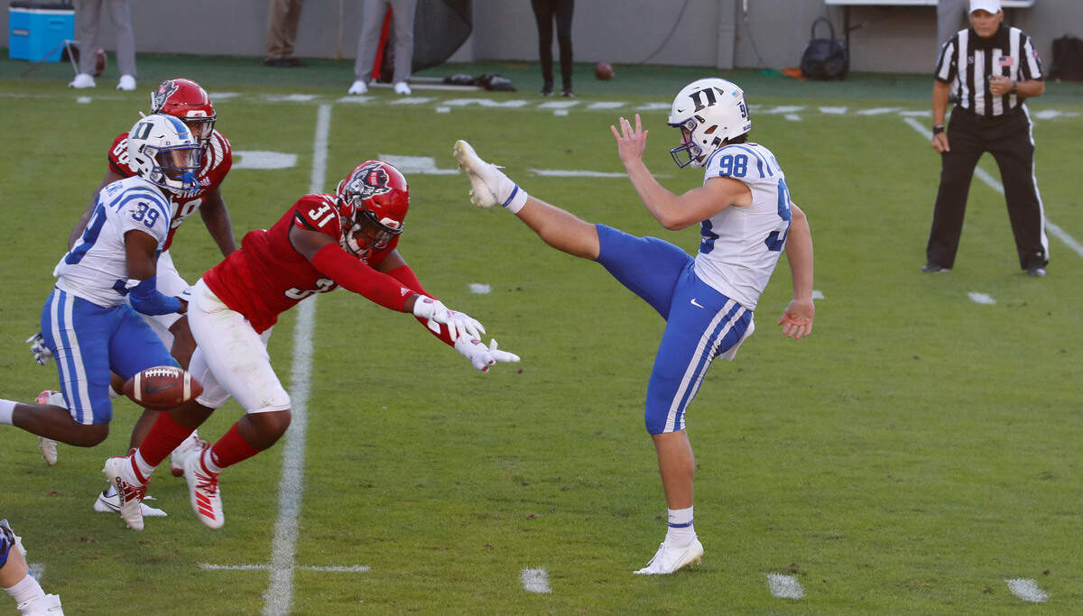 N.C. State linebacker Vi Jones (31) blocks the punt by Duke punter Porter Wilson (98) during the first half of N.C. State’s game against Duke at Carter-Finley Stadium in Raleigh, N.C., Saturday, Oct. 17, 2020.