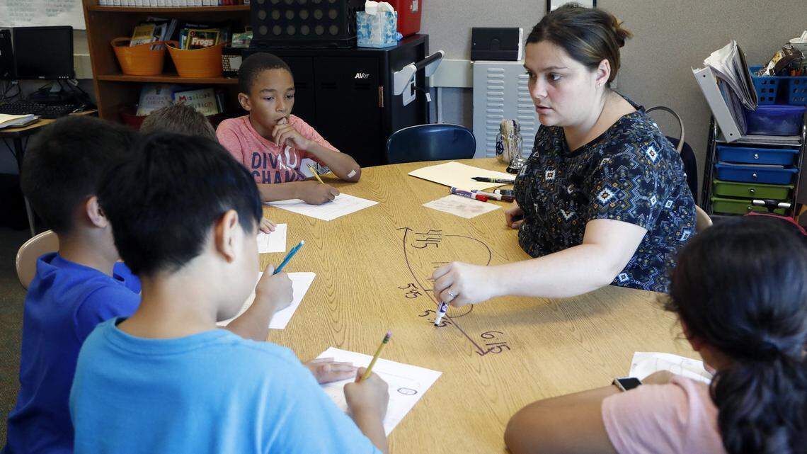 Olive Chapel Elementary School third-grade teacher Stacie York gives a lesson to her students at the school in Apex on May 14, 2018. The Wake County school system is reducing the amount of local raises this year for teachers to help balance the budget.