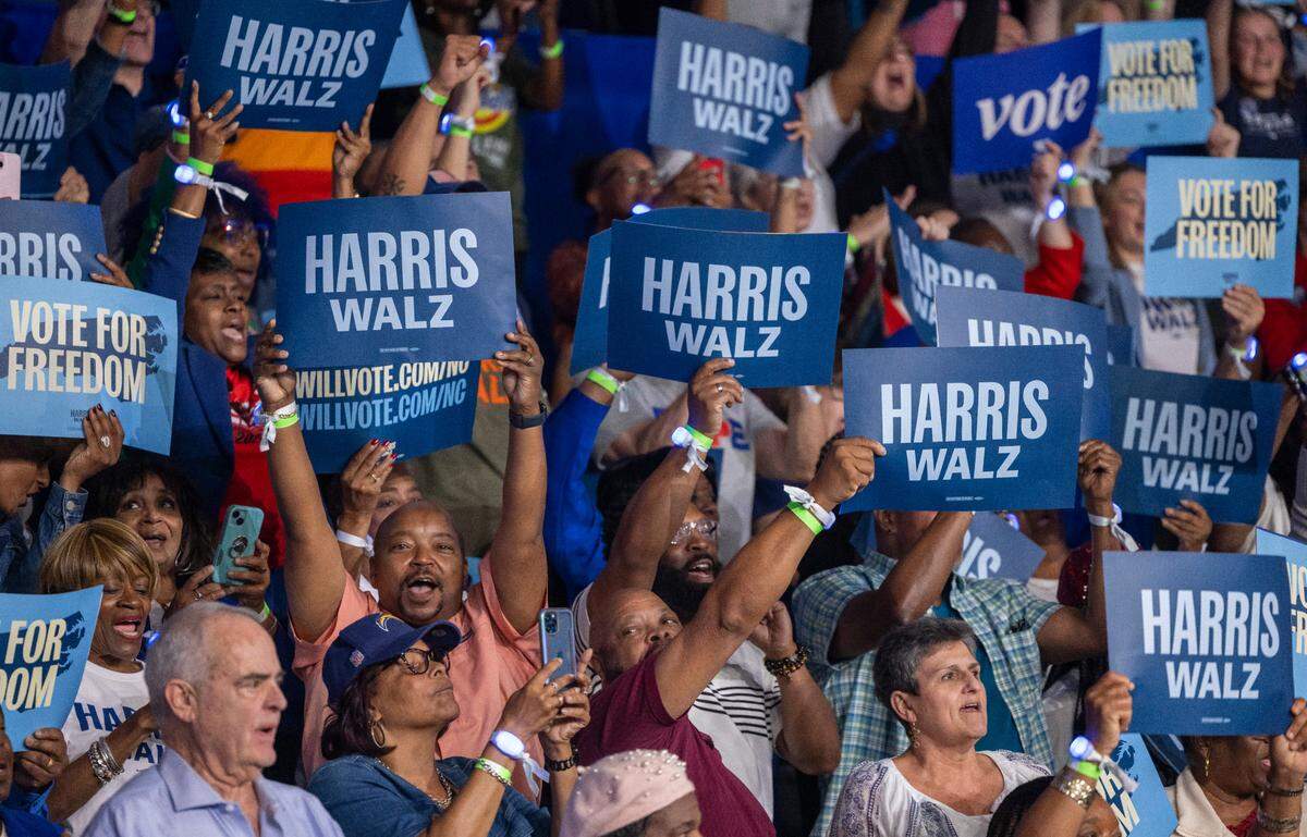 Supporters of Vice President Kamala Harris, the Democratic Presidential nominee, show their support as she arrives for a rally on Sunday, October 13, 2024 at Minges Coliseum in Greenville, N.C.