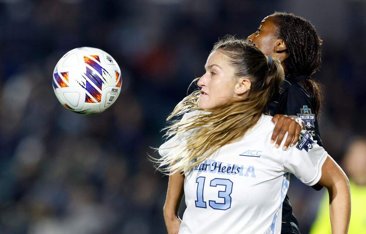 Wake Forest’s Malaika Meena (10) and North Carolina’s Kate Faasse (13) keep an eye on the ball during the second half of UNC’s 1-0 victory over Wake Forest in the finals of the 2024 Women’s College Cup at WakeMed Soccer Park in Cary, N.C., Monday, Dec. 9, 2024.