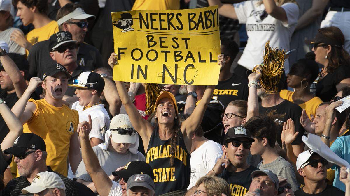 Appalachian State fans celebrate after the Mountaineers took a ten point lead over North Carolina in the third quarter on Saturday, September 21, 2019 at Kenan Stadium in Chapel Hill, N.C.