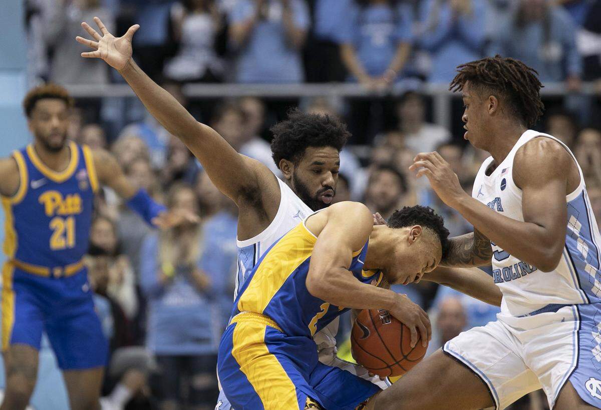 Pittsburgh’s Trey McGowens (2) is trapped by North Carolina’s Jeremiah Francis (13) and Armando Bacot (5) during the first half on Wednesday, January 8, 2020 at the Smith Center in Chapel Hill, N.C.