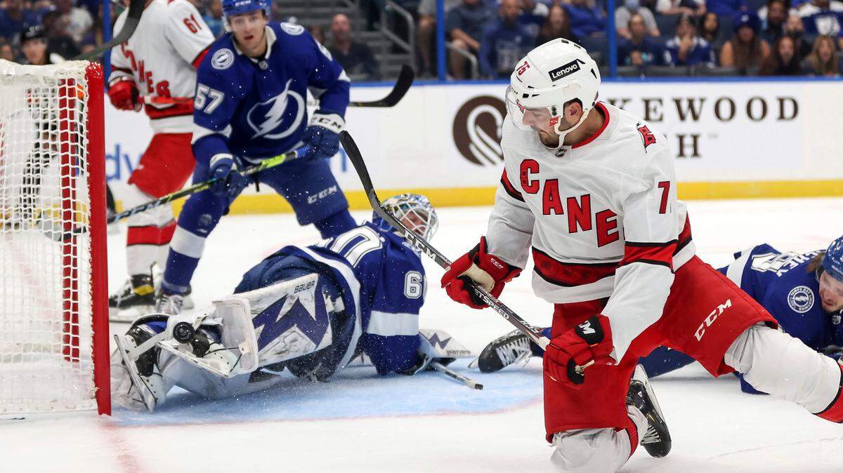 Carolina Hurricanes’ Spencer Smallman backhands a goal past Tampa Bay Lightning goaltender Hugo Alnefelt as Brandon Crawley (57) defends during the first period of a preseason NHL hockey game Friday, Oct. 1, 2021, in Tampa, Fla. (AP Photo/Mike Carlson)