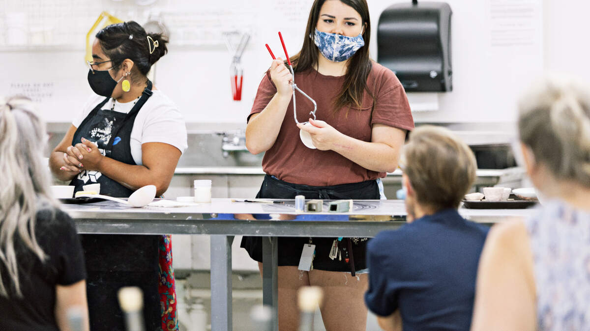 From left, instructors Laura Casas and Caroline Radcliff give a demonstration on glazing during a pottery class at Pullen Arts Center in Raleigh on Wednesday, Aug. 11, 2021. Other classes at the center include bookmaking, drawing, jewelry, painting, and printmaking, with classes offered for all ages and skill levels.