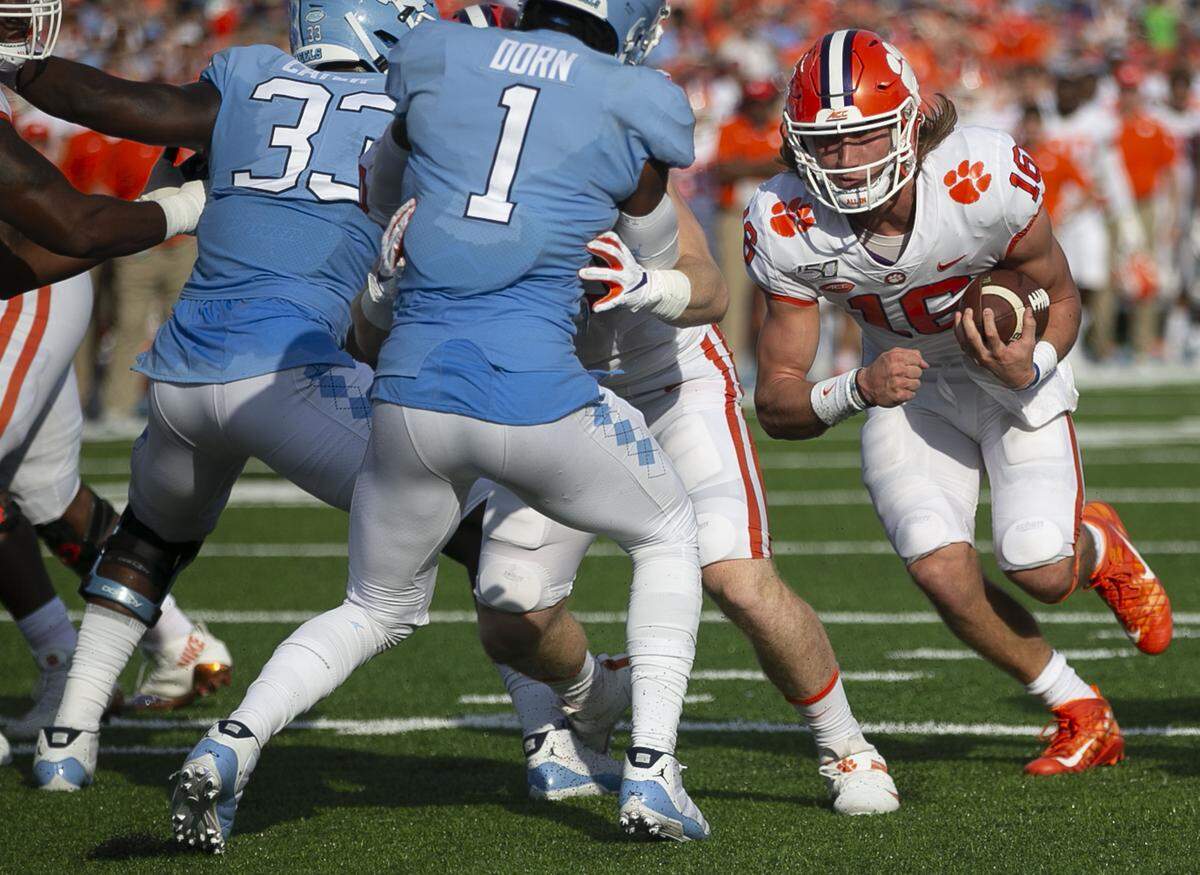 Clemson quarterback Trevor Lawrence (16) scores a touchdown on a three-yard run to tie North Carolina 14-14 in the second quarter on Saturday, September 28, 2019 at Kenan Stadium in Chapel Hill, N.C.