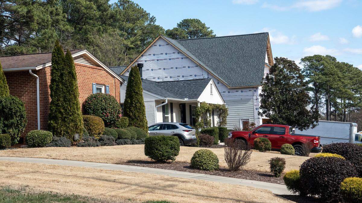 A two-story home under construction dwarfs it ranch-style neighbors on Duke Road in the Raleigh, NC Quail Ridge neighborhood, Feb. 23, 2026.