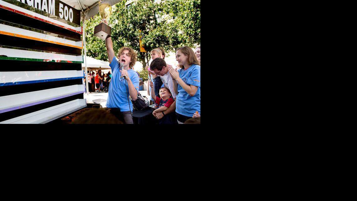 Alasdair Johnson, a junior curator at the N.C. Museum of Natural Sciences, announces the winner of the Roachingham 500 at BugFest hosted by the North Carolina Museum of Natural Sciences in downtown Raleigh on Saturday.
