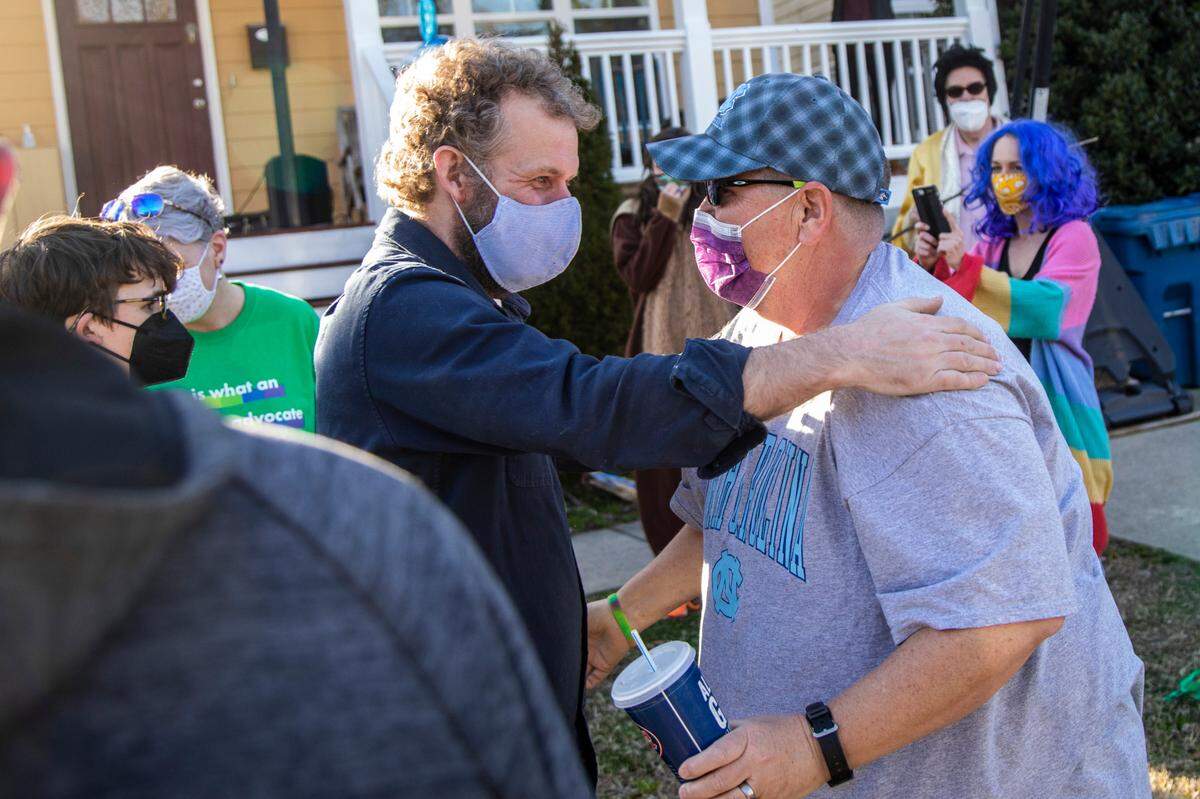 After serving nearly 30 years in prison, Sandy Dowell, right, is greeted by Rev. Franklin Golden during a welcoming party in Durham after DowellÕs prison release Monday, March 8, 2021. A lawsuit related to state prison conditions during COVID-19 has resulted in a settlement releasing 3,500 people in prison over the next six months.