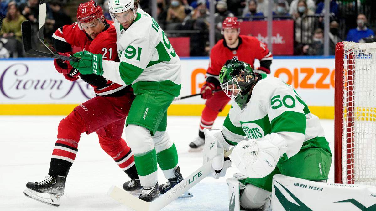 Toronto Maple Leafs goaltender Erik Kallgren (50) makes a save as Carolina Hurricanes right wing Nino Niederreiter (21) and Maple Leafs center John Tavares (91) watch during the first period of an NHL hockey game Thursday, March 17, 2022, in Toronto. (Frank Gunn/The Canadian Press via AP)