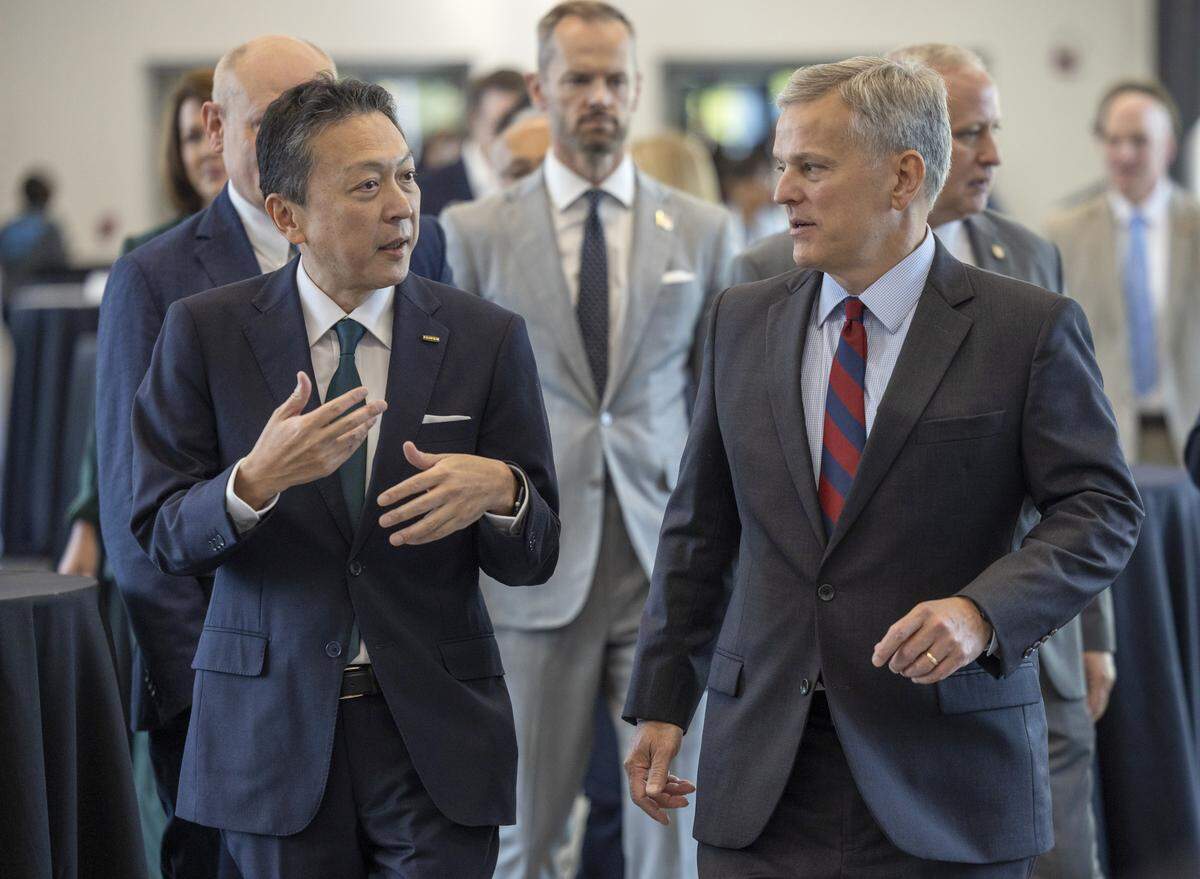Toshi Iida, Chairman of Fujifilm Biotechnologies talks with North Carolina Governor Josh Stein as they walk to the ribbon cutting for Fujifilm’s $3.2 billion bio-pharmaceutical manufacturing  facility grand opening on Wednesday, September, 24, 2025 in Holly Springs, N.C.