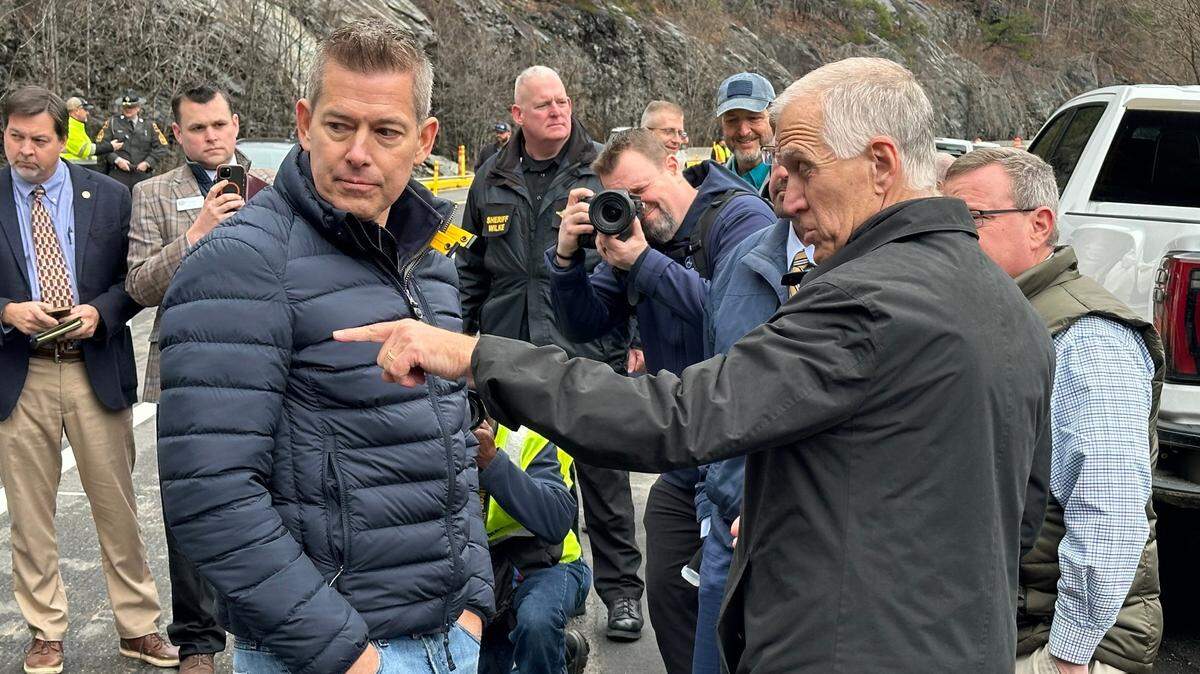 U.S. Sen. Thom Tillis talks with new Secretary of Transportation and Trump-appointee Sean Duffy at the site of washed out sections of I-40 in the Pigeon River Gorge, Feb. 10, 2025.