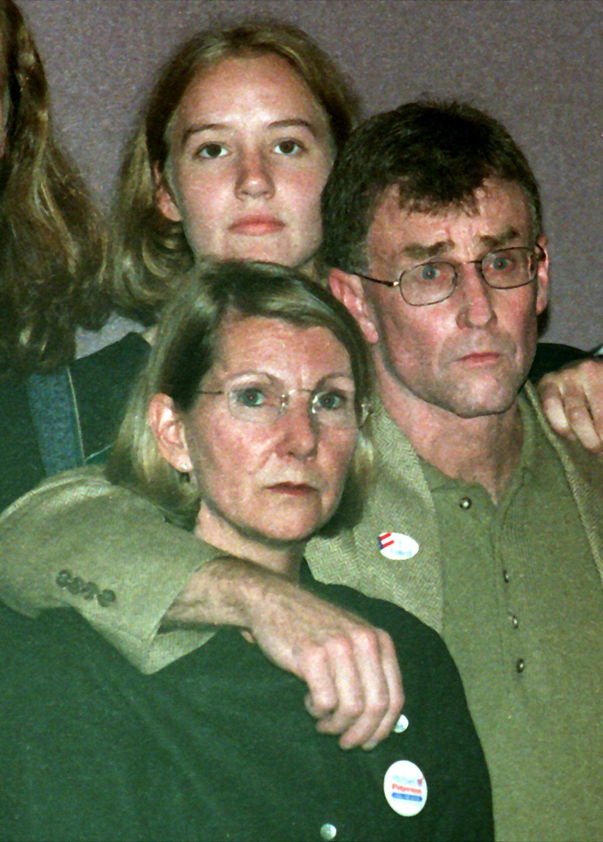 Michael Peterson stands with his wife Kathleen as he watches the final tally come up short for him in his quest for mayor of Durham in 1999.