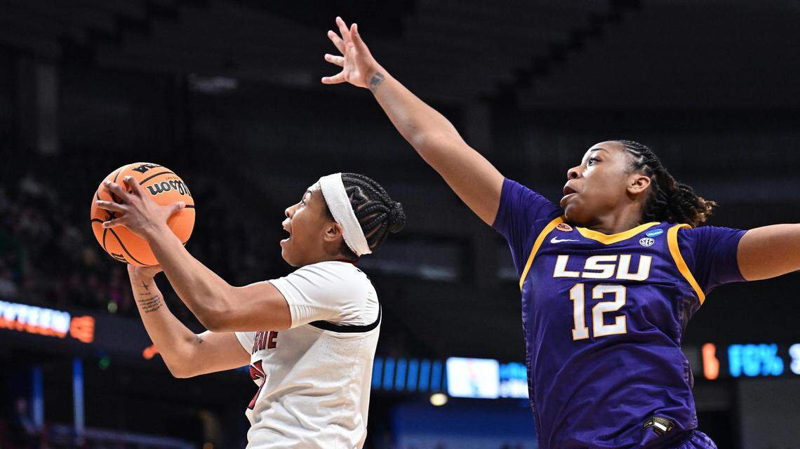 NC State Wolfpack guard Zoe Brooks (35) shoots against LSU Lady Tigers guard Mikaylah Williams (12) during the first half of a Sweet 16 NCAA Tournament basketball game at Spokane Arena.