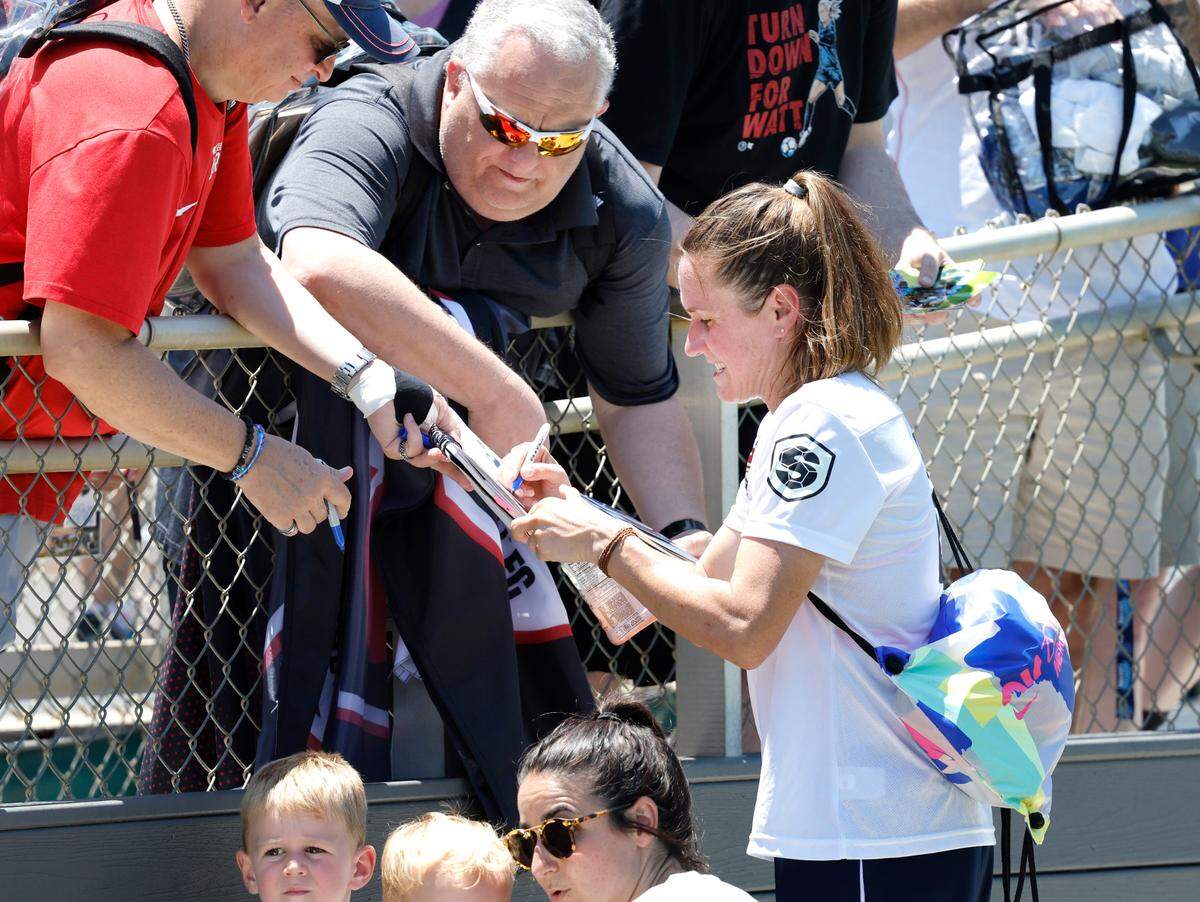 US Women’s Heather O’Reilly (9) signs autographs for fans after Streetball FC Canada’s 3-0 victory over the US Women during the TST Soccer Tournament at WakeMed Soccer Park in Cary, N.C., Friday, June 7, 2024.