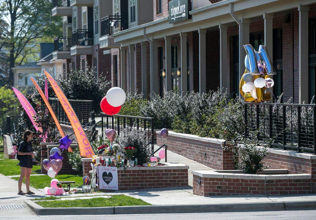 A memorial has been set up outside the Signature 1505 apartments on Hillsborough Street on Wednesday, April 7, 2021 for Christina Maria Matos, a 20-year-old woman that was found dead inside her apartment over the weekend in Raleigh, N.C.